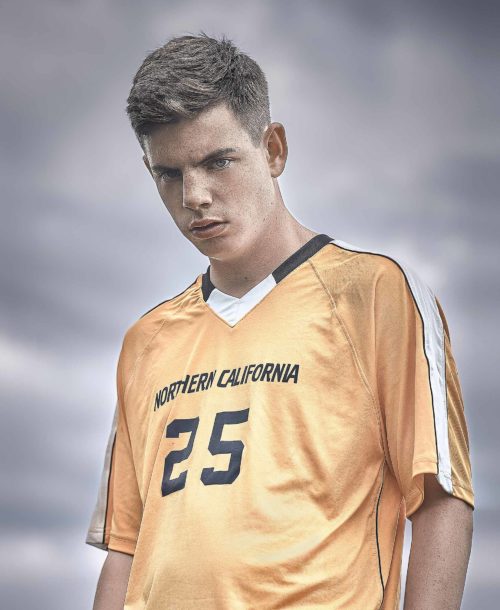 Sean, a player on the Clovis North Unified soccer team posing for the camera.