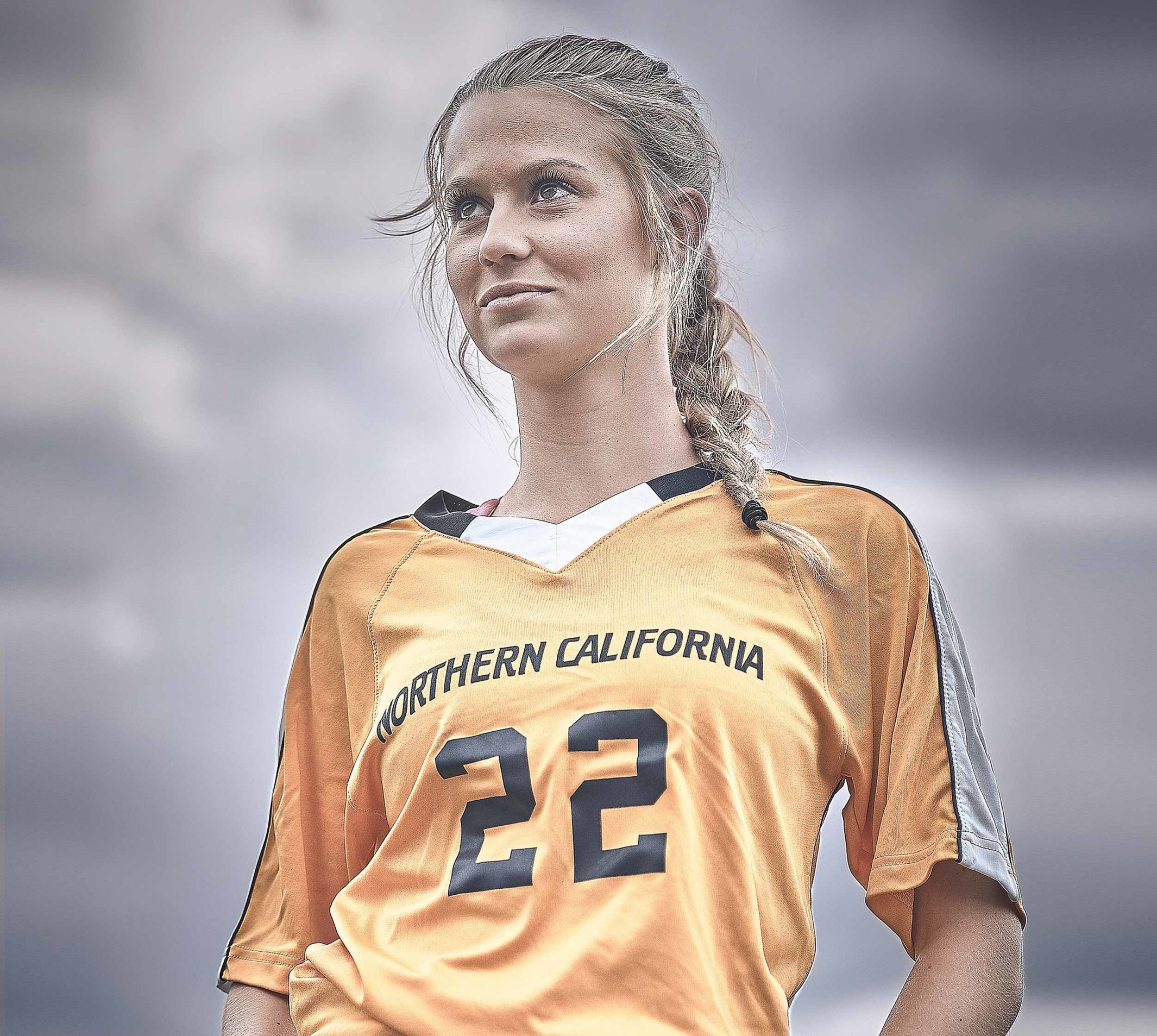 Sydney, a player on the Clovis North Unified soccer team posing for the camera.