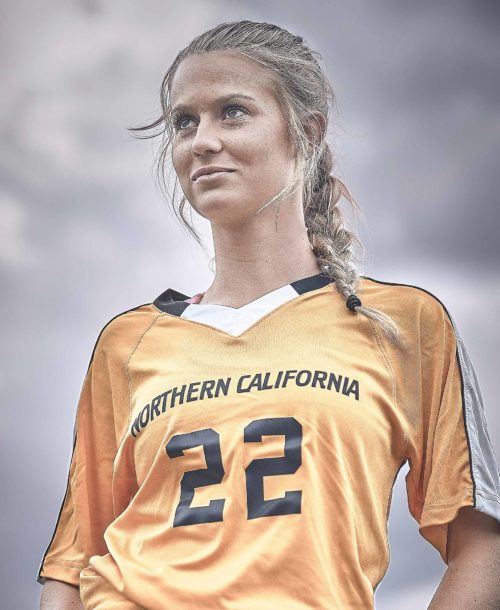 Sydney, a player on the Clovis North Unified soccer team posing for the camera.