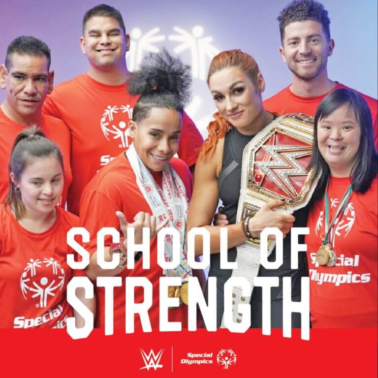 WWE Superstar Becky Lynch posing with Special Olympics athletes to promote School of Strength.