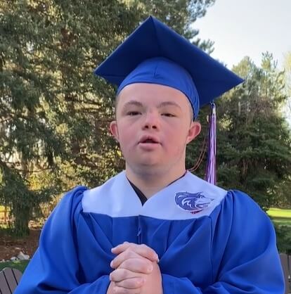 A student in his cap and gown.