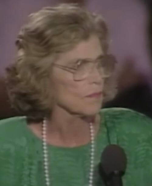Special Olympics founder Eunice Kennedy Shriver delivers a speech at a podium.