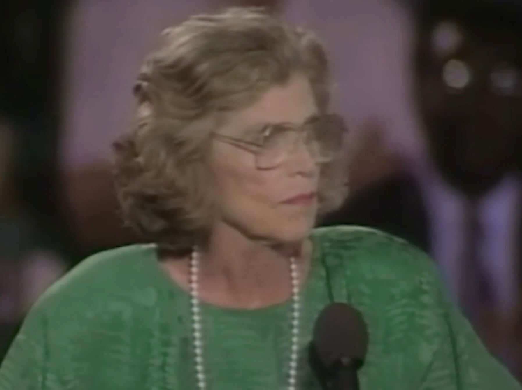 Special Olympics founder Eunice Kennedy Shriver delivers a speech at a podium.