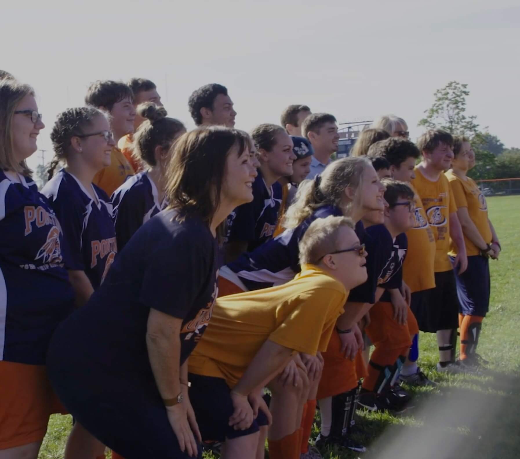 Unified athletes pose for a photograph.