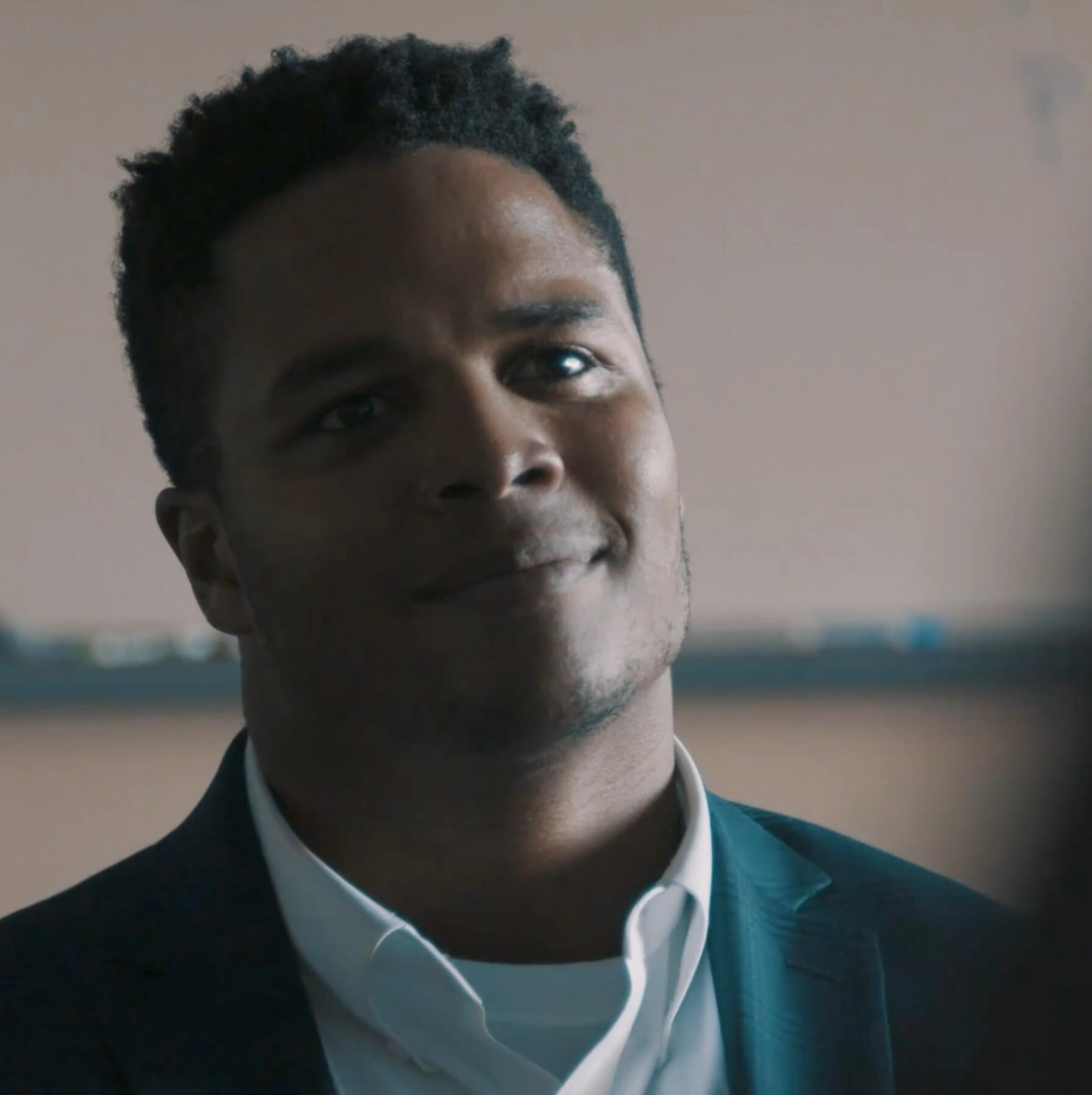 Eddie Yarbrough seated in a high school classroom.