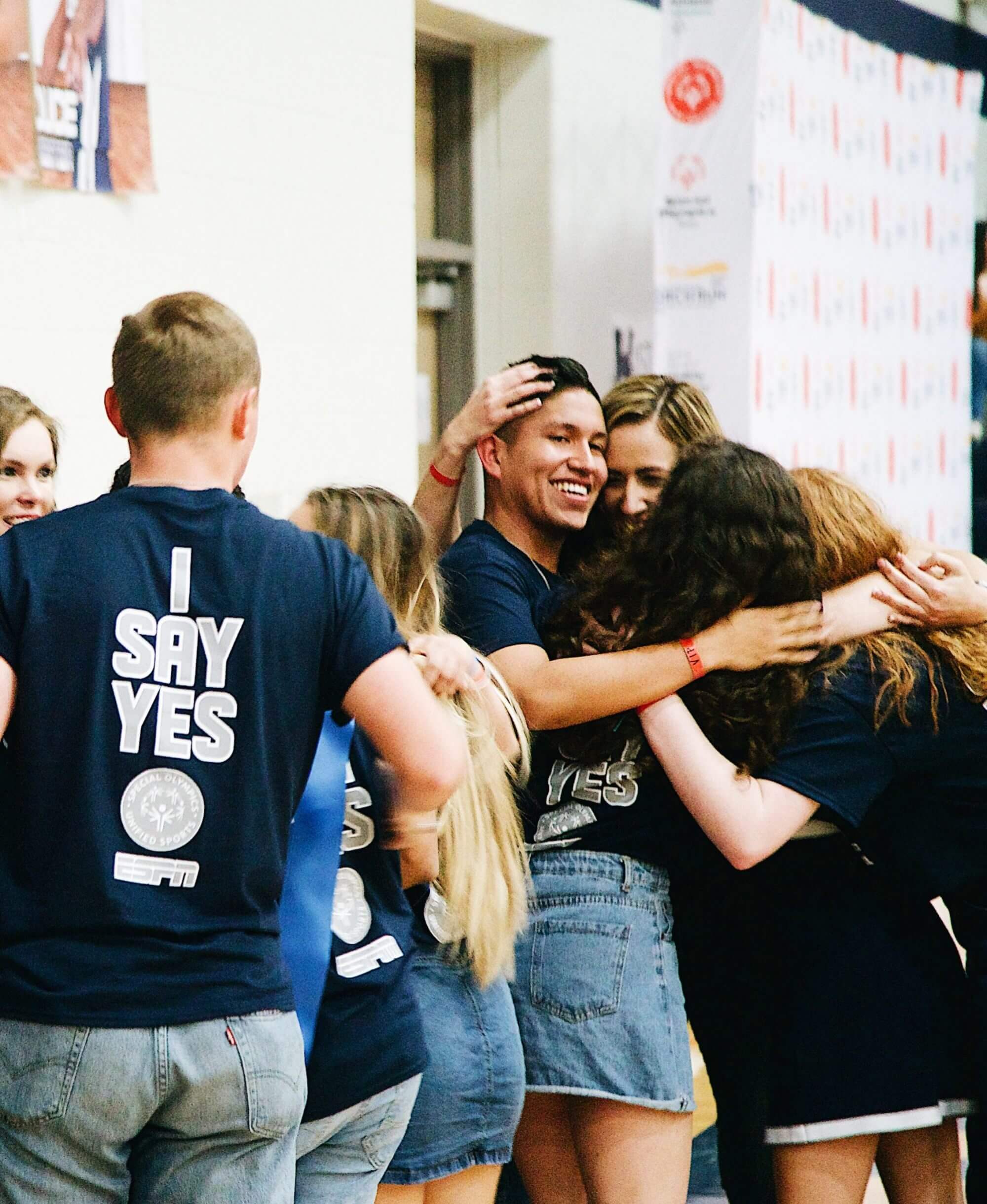 A group of Hendrickson High School students hugging.