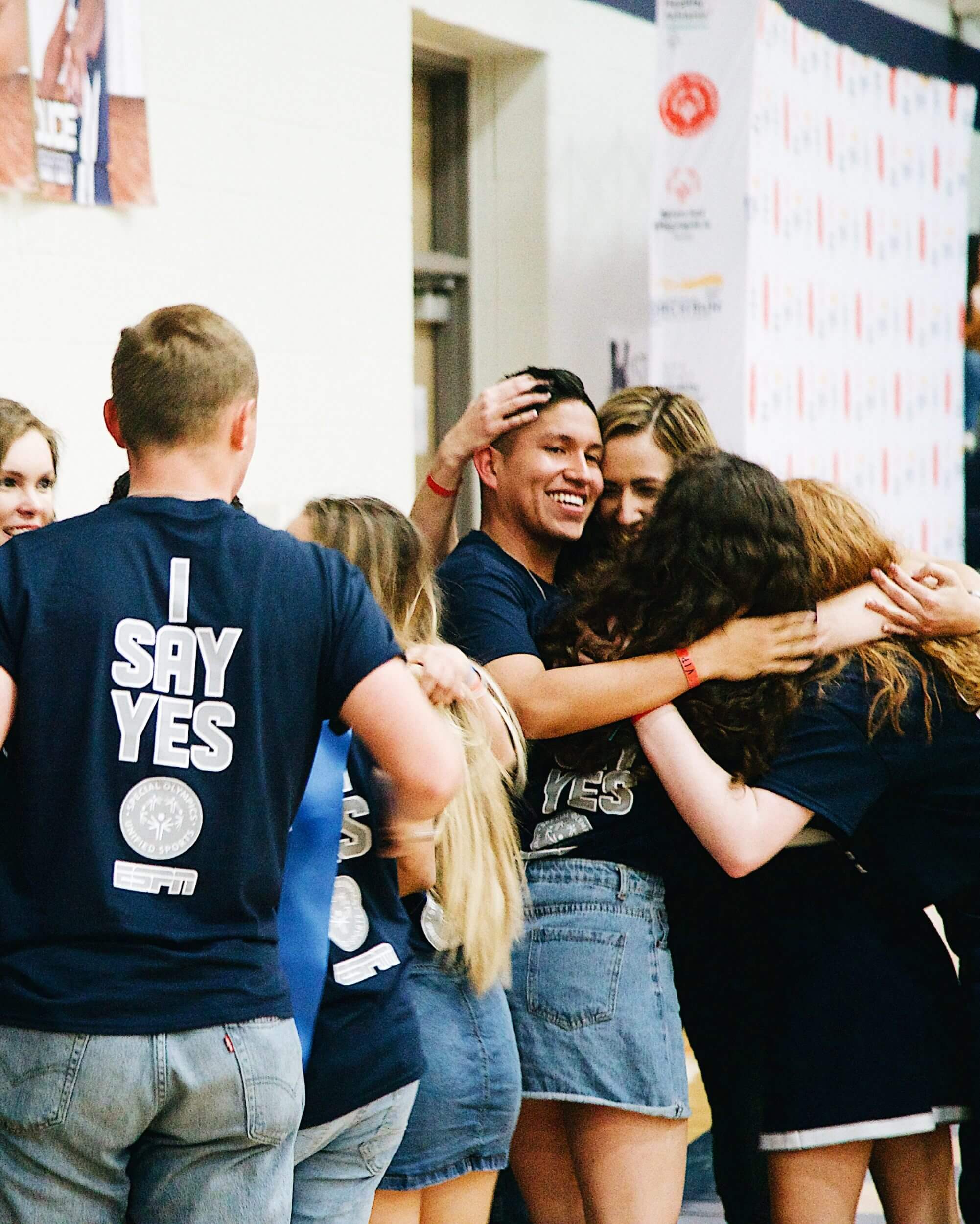 A group of Hendrickson High School students hugging.