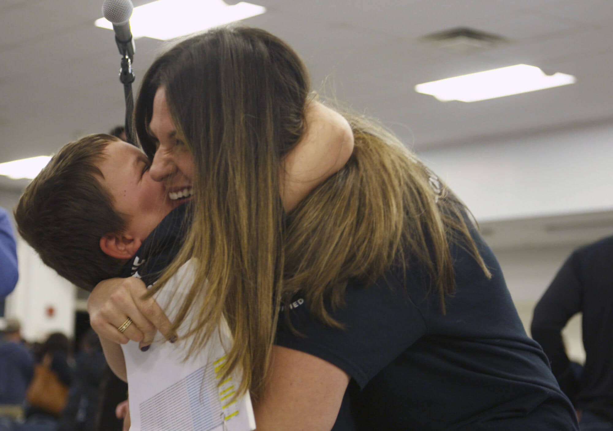 A student hugs a teacher from Sayreville School District in New Jersey.