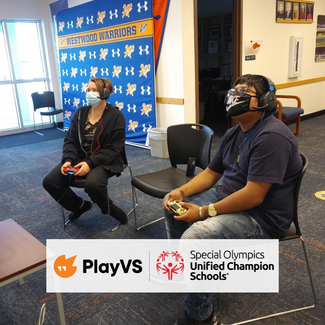 Two students, socially distanced and wearing masks playing Unified esports. The PlayVS and Unified Champion Schools logos are at the bottom of the image.
