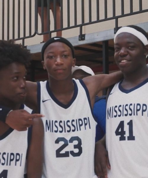 3 teammates from the Mississippi Delta Boys & Girls Club team poses for a picture.
