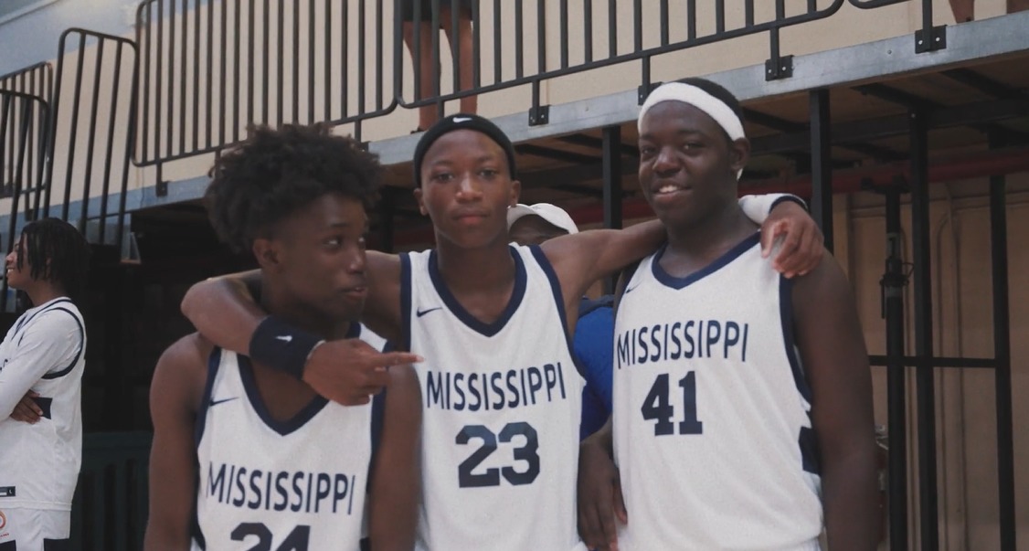 3 teammates from the Mississippi Delta Boys & Girls Club team poses for a picture.