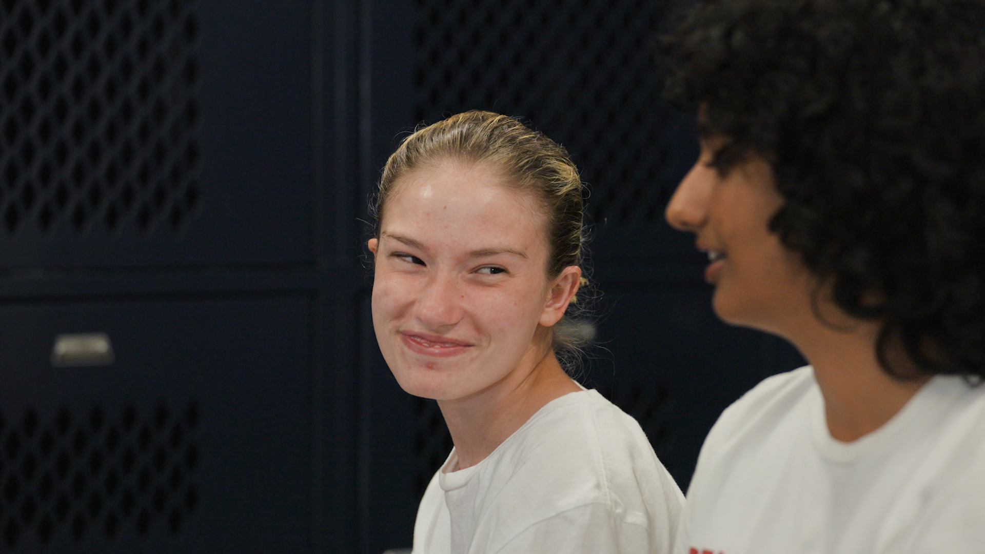 Special Olympics Ohio athlete Kali Ohlemacher smiling at her Unified partner Anisha.